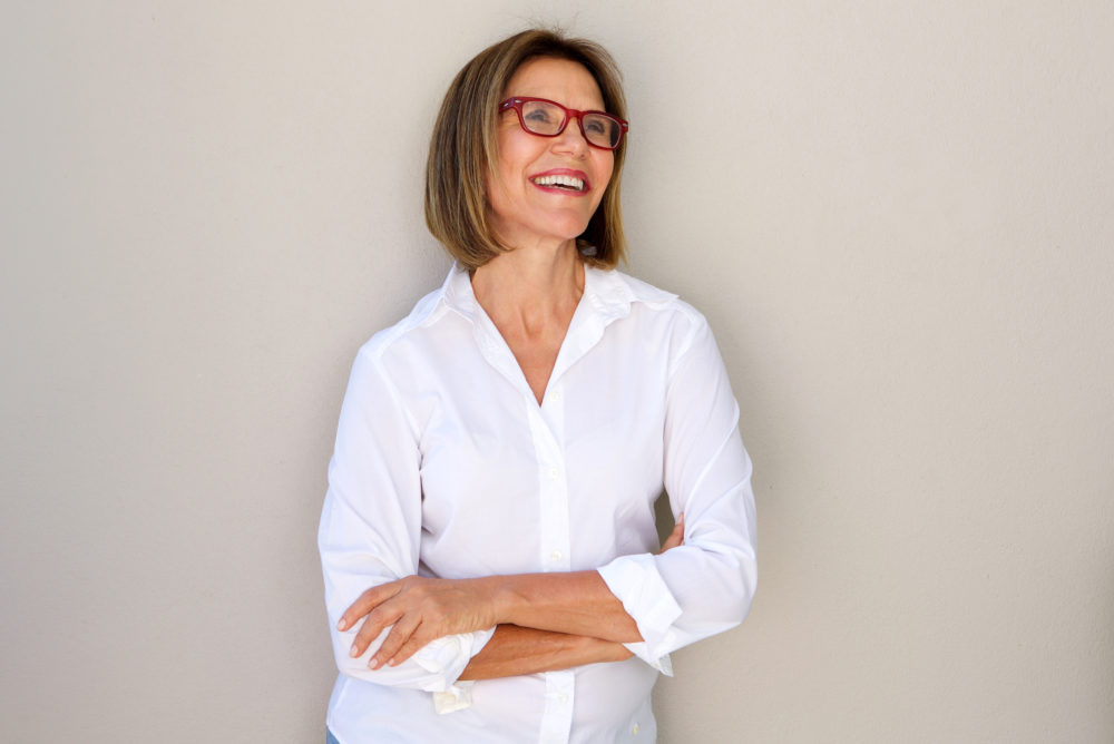 business woman with glasses smiling